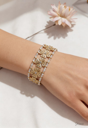 Calys - Bracelet manchette doré fleurs et pierres blanches