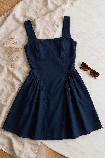 Ariana - Robe courte patineuse bleu marine avec noeud au dos